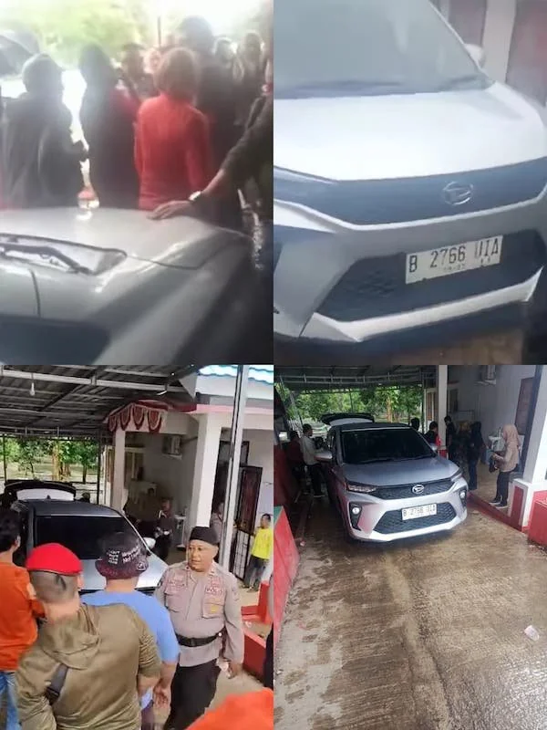 Mobil dinas Kantor Bawaslu Jeneponto, saat ditahan massa pendukung Paslon saat hendak keluar dari Kantornya. (Tangkapan layar/ ist).