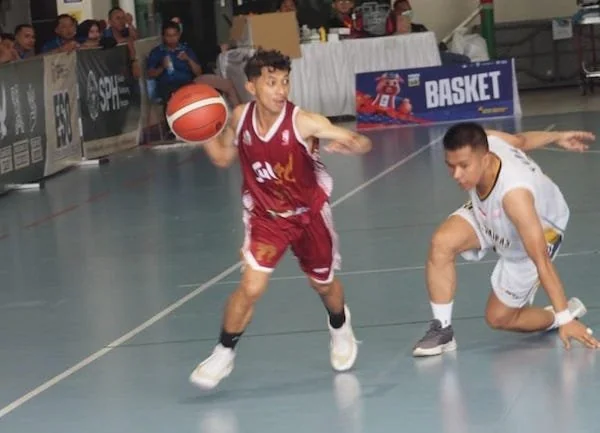 Ramdhani (merah), playmaker di tim basket putra Sulsel pada ajar Pornas Korpri XVII Palembang (dok. Ist)